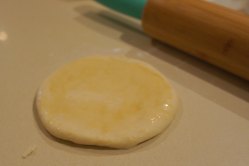 Chinese steamed bun - rolling out the dough into a round disc
