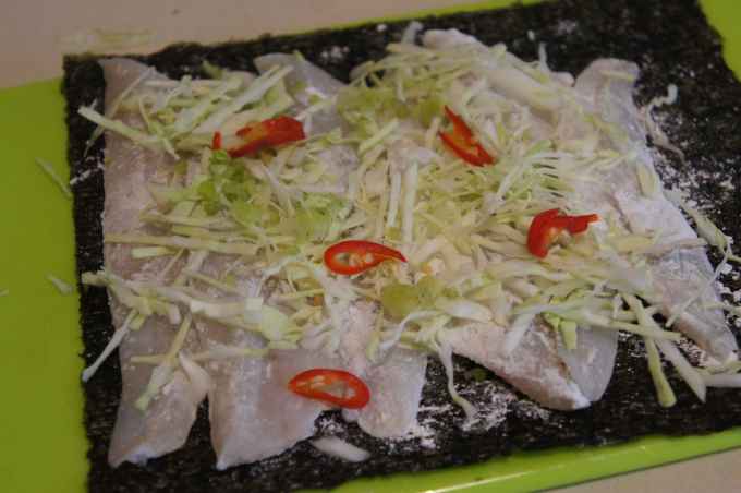 Whiting fillets over nori sheet, with cabbage and chili