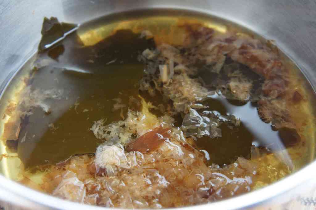 Bonito flakes (Katsuobushi) and kelp cooking in a pot to make dashi