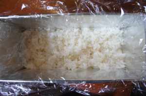 Sushi terrine with vegetables - rice as the first layer