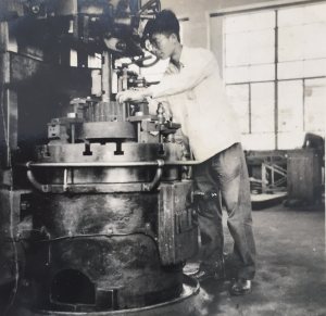 My father working on a machine