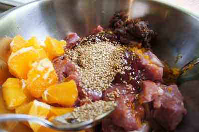 Pork shoulder being marinated for sweet & sour pork
