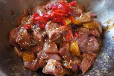 Pork shoulder being marinated