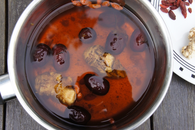 Tradition Chinese herbal tea with 'dang gui' 當歸, goji berries 枸杞 and red dates 红枣 