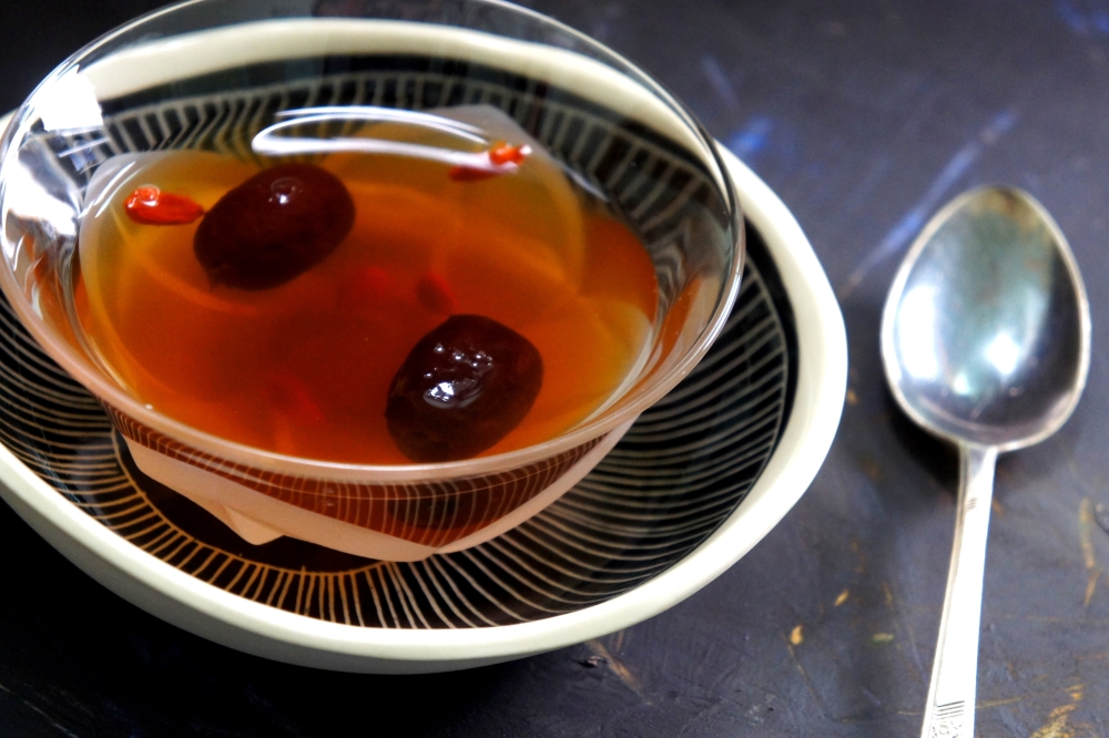 Tradition Chinese tonic (herbal tea) with 'dang gui' 當歸, goji berries 枸杞 and red dates 红枣